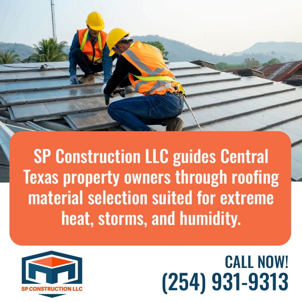 Roofing contractors installing metal roof panels on residential property